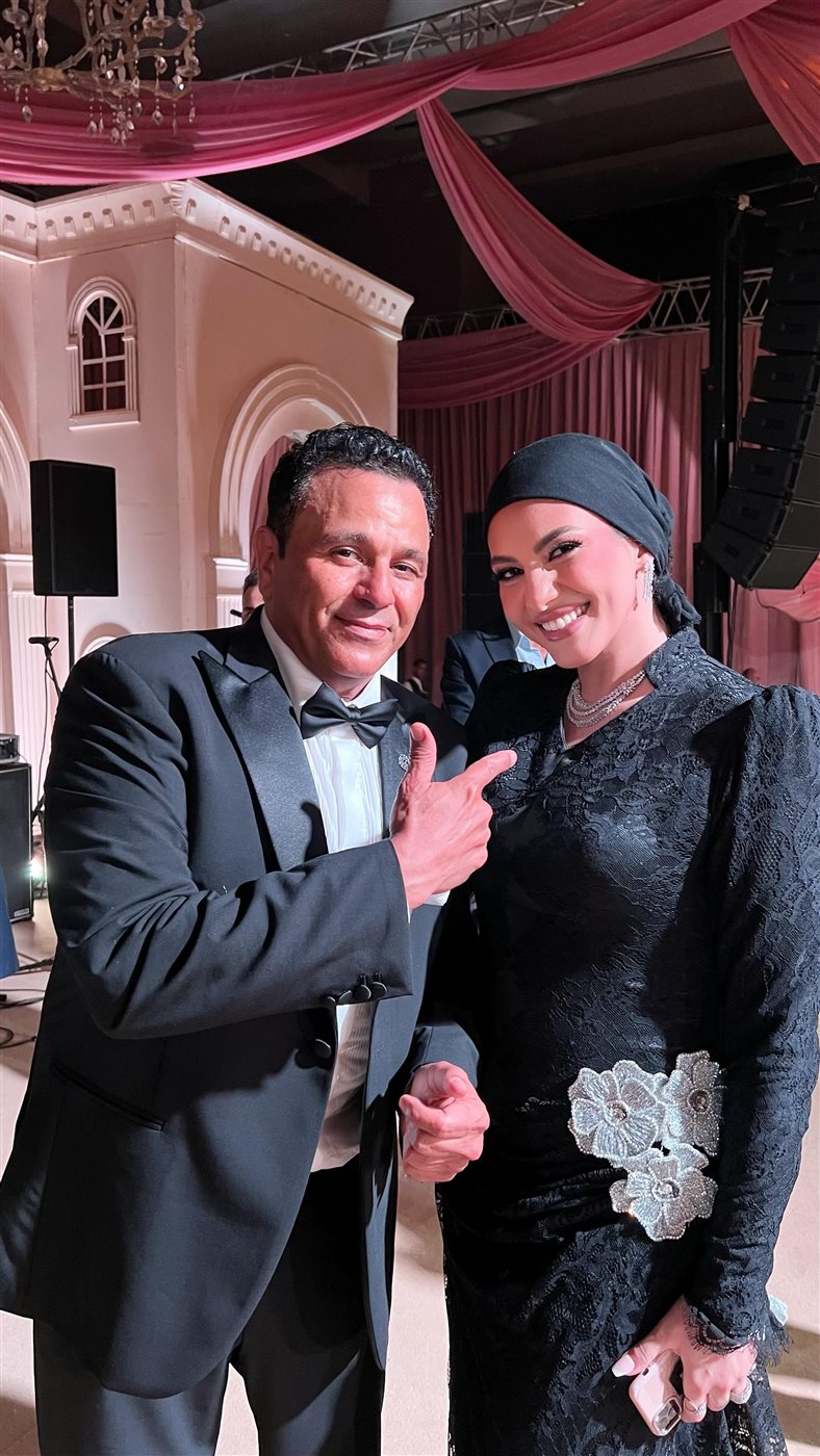 المصممة أميرة قزامل ومحمد فؤاد