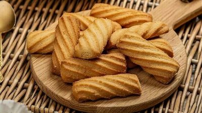 استعدادًا للعيد.. طريقة عمل بسكوت جوز الهند وغريبة باللوز