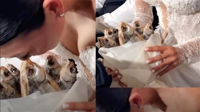 عريس يفاجىء زوجته بباقة من السمك المجفف في ليلة زفافهما 