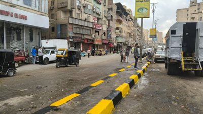 محافظة الجيزة تنفذ حملة نظافة مكبرة بشارع عثمان محرم في الطالبية والعمرانية