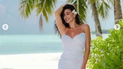 بفستان أبيض على البحر.. ياسمين صبري في جلسة تصوير صيفية جديدة|صور