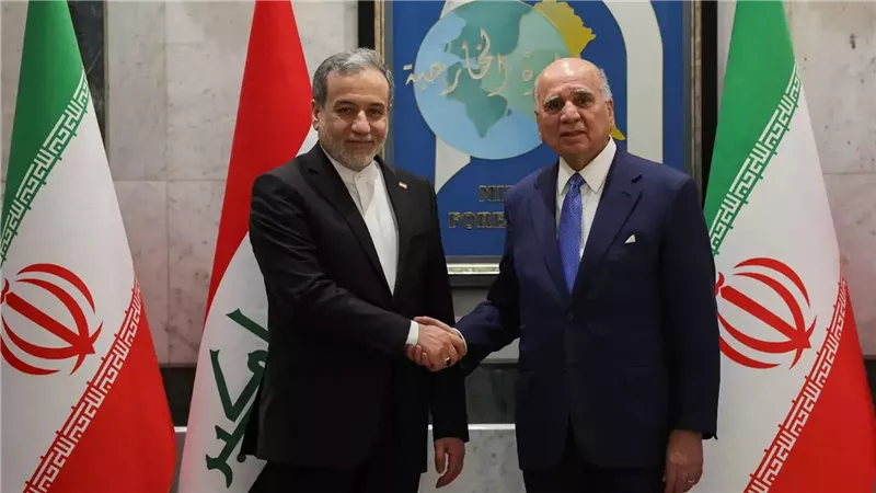 فؤاد حسين وعباس عراقجي