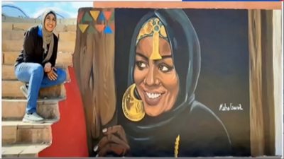 إبداع نوبي يزين جداريات أسوان ويبرز دور المرأة النوبية  ( فيديو)