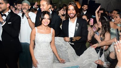 أمل رزق تحتفل بزفاف ابنتها هيا .. والعروس تتألق بفستان للبحيري (صور) 